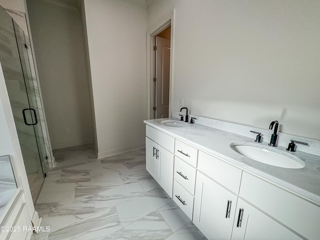 bathroom with double vanity, a shower stall, a sink, and marble finish floor
