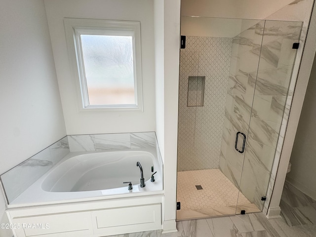 full bath featuring a bath and a stall shower