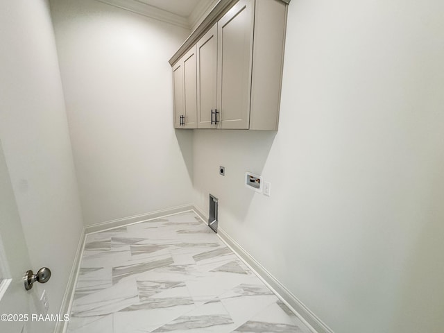 clothes washing area with crown molding, baseboards, electric dryer hookup, cabinet space, and washer hookup