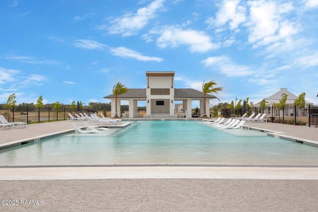 pool featuring a patio and fence