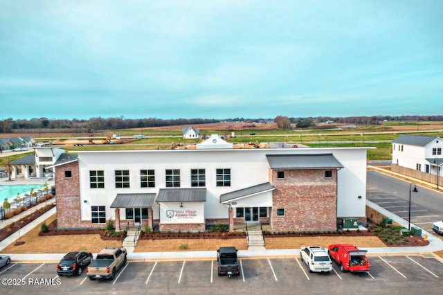 exterior space with uncovered parking