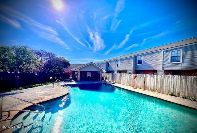 view of pool with a fenced backyard, a patio area, and a fenced in pool
