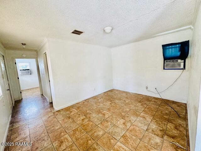 321 S Academy St, Opelousas, LA 70570 - unfurnished room with a textured ceiling and ornamental molding