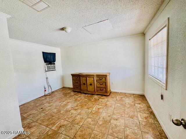 321 S Academy St, Opelousas, LA 70570 - spare room featuring a textured ceiling