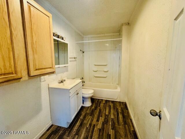 321 S Academy St, Opelousas, LA 70570 - full bathroom with wood finished floors, crown molding, toilet, vanity, and baseboards