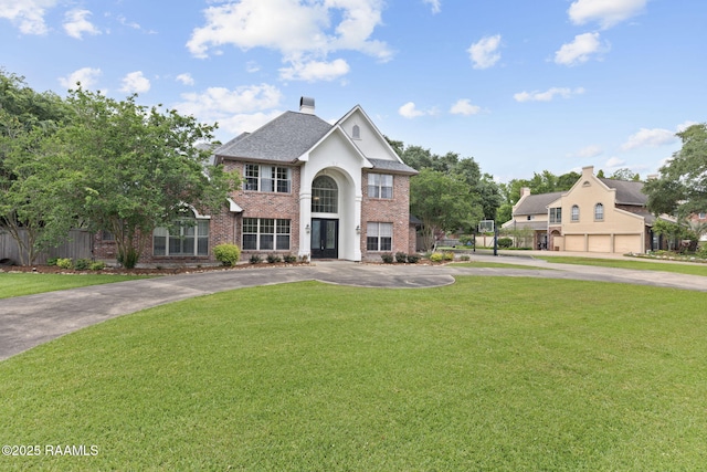 6 Oak Pl, New Iberia, LA 70563 - view of front of home with fence, a front yard, driveway, and brick siding
