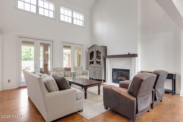 6 Oak Pl, New Iberia, LA 70563 - living area with baseboards, high vaulted ceiling, french doors, and a fireplace