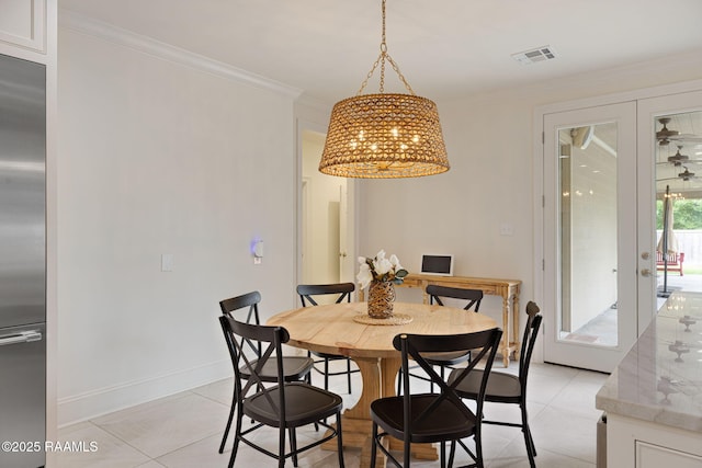 6 Oak Pl, New Iberia, LA 70563 - dining space featuring light tile patterned flooring, a notable chandelier, french doors, visible vents, and ornamental molding