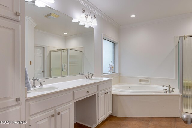 6 Oak Pl, New Iberia, LA 70563 - bathroom with visible vents, a sink, a bath, and a stall shower