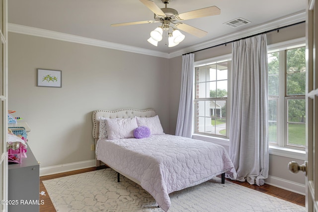 6 Oak Pl, New Iberia, LA 70563 - bedroom featuring baseboards, visible vents, ornamental molding, and wood finished floors