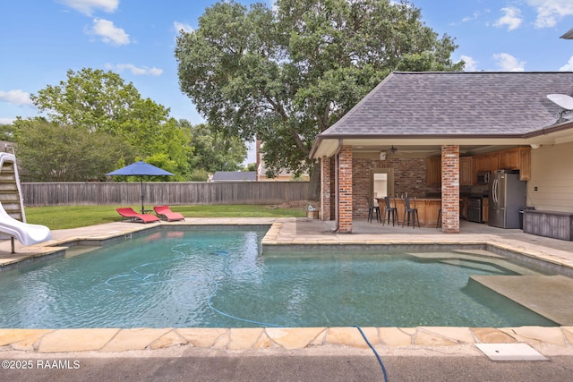 6 Oak Pl, New Iberia, LA 70563 - view of swimming pool with a fenced backyard, outdoor dry bar, a water slide, and a fenced in pool
