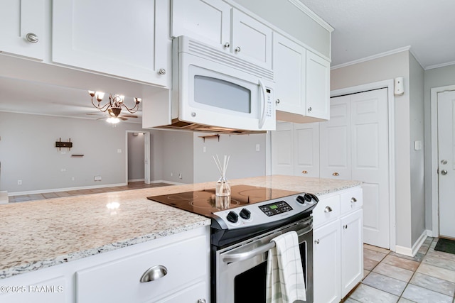 307 Creswell Ave, Scott, LA 70583 - kitchen with an inviting chandelier, ornamental molding, white microwave, white cabinets, and stainless steel electric stove