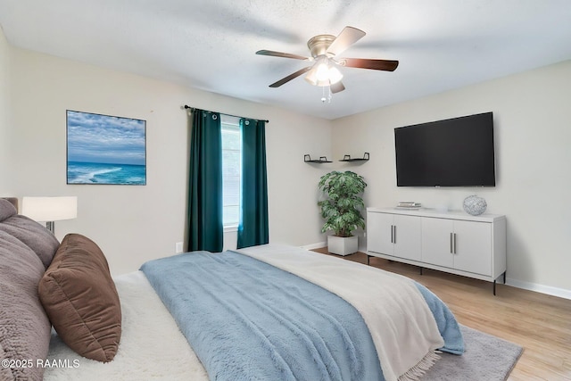 307 Creswell Ave, Scott, LA 70583 - bedroom with a ceiling fan, baseboards, and light wood-style floors