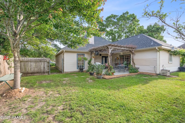 122 Ashford Ln, Youngsville, LA 70592 - back of property with a pergola, a patio, and roof with shingles