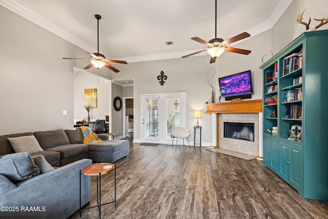 122 Ashford Ln, Youngsville, LA 70592 - living area with ceiling fan, a fireplace, dark wood-style floors, ornamental molding, and baseboards