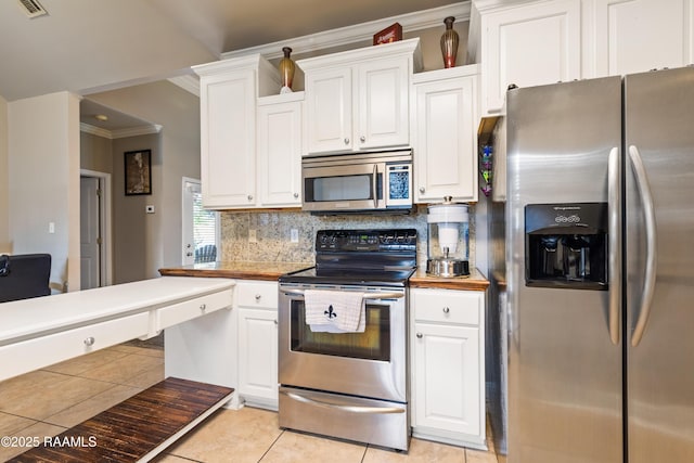 122 Ashford Ln, Youngsville, LA 70592 - kitchen with stainless steel appliances, crown molding, white cabinetry, backsplash, and light tile patterned floors