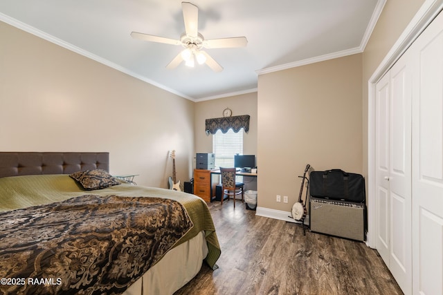 122 Ashford Ln, Youngsville, LA 70592 - bedroom with dark wood-type flooring, ornamental molding, a closet, baseboards, and a desk