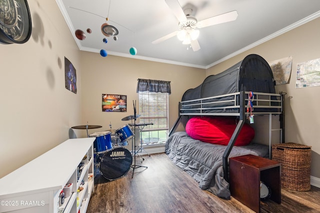 122 Ashford Ln, Youngsville, LA 70592 - bedroom with wood finished floors, crown molding, ceiling fan, and baseboards