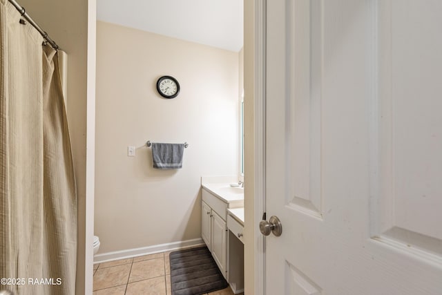 122 Ashford Ln, Youngsville, LA 70592 - full bathroom featuring vanity, tile patterned floors, toilet, and baseboards