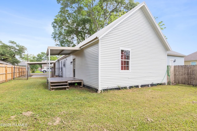 back of house featuring a yard, a deck, and a fenced backyard