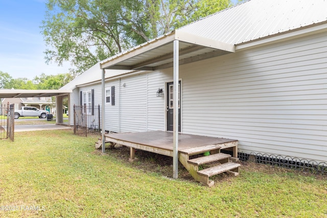 exterior space featuring a lawn and a carport