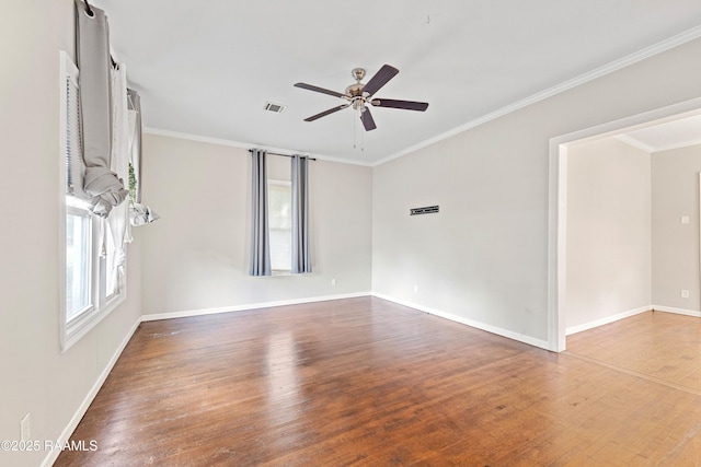 spare room featuring ornamental molding, ceiling fan, and wood finished floors