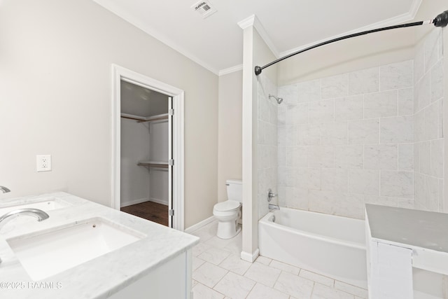 bathroom with a sink, crown molding, toilet, and visible vents