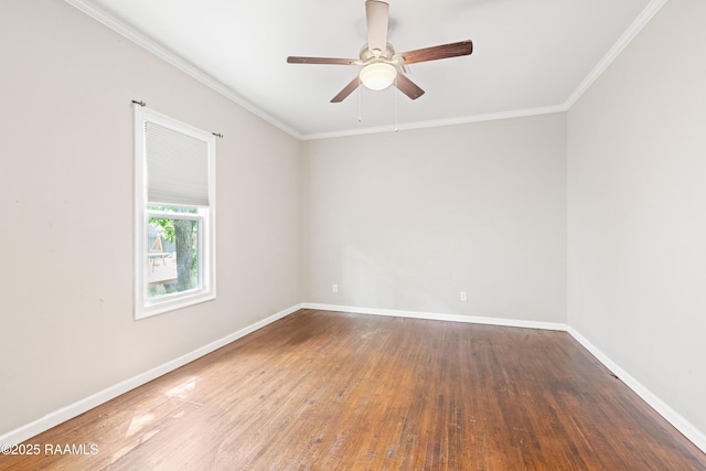empty room with baseboards, crown molding, ceiling fan, and wood finished floors