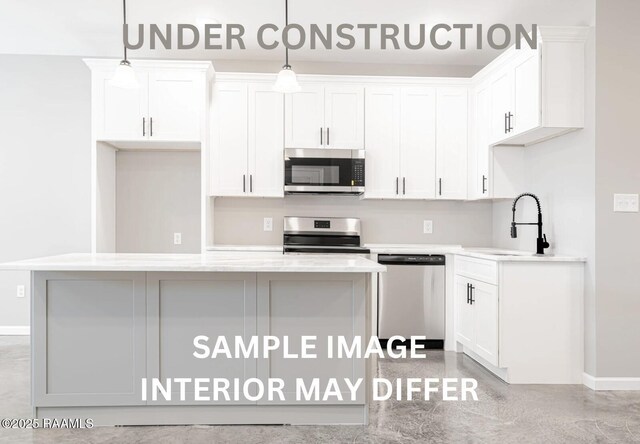 kitchen featuring white cabinets, stainless steel appliances, baseboards, and a sink