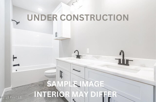 bathroom with a sink, bathing tub / shower combination, toilet, and double vanity