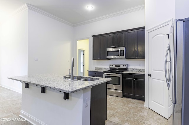 115 Maddox Jude Dr, Maurice, LA 70555 - kitchen featuring a breakfast bar area, crown molding, a sink, light tile patterned floors, and stainless steel appliances