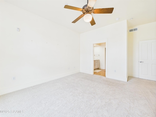 1127 Camellia Blvd Unit H1, Lafayette, LA 70508 - unfurnished bedroom featuring light colored carpet, baseboards, ensuite bath, and ceiling fan