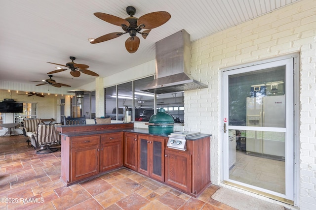 view of patio / terrace with ceiling fan and area for grilling