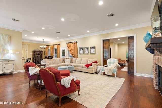 living area with a brick fireplace, recessed lighting, visible vents, and dark wood-type flooring