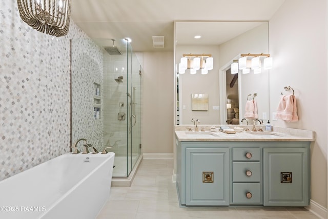 bathroom with a sink, a soaking tub, a stall shower, and double vanity