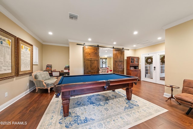 playroom with visible vents, baseboards, dark wood-type flooring, a barn door, and french doors