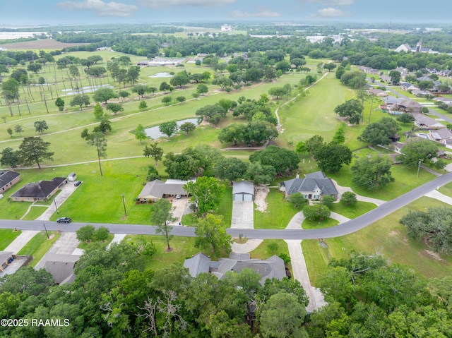 drone / aerial view with a water view and a residential view