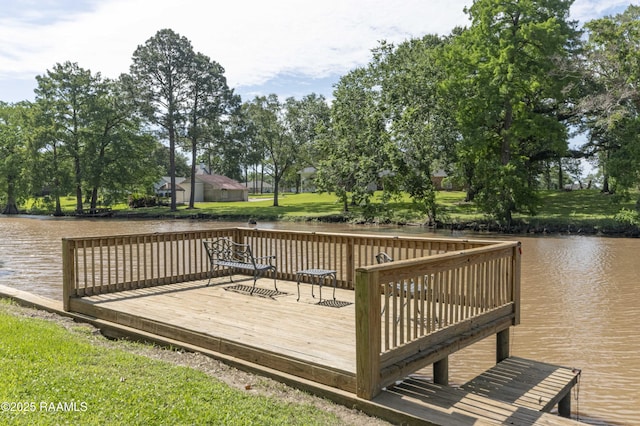 wooden deck with a water view