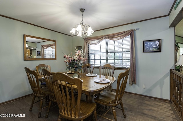 dining room featuring a wealth of natural light, wood finished floors, ornamental molding, and a notable chandelier