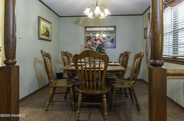 dining area featuring an inviting chandelier, crown molding, baseboards, and wood finished floors