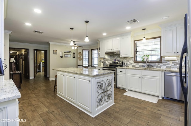kitchen with a sink, under cabinet range hood, visible vents, and appliances with stainless steel finishes