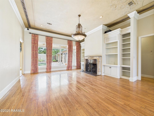 107 Wembley Rd, Lafayette, LA 70503 - unfurnished living room featuring visible vents, ornamental molding, and light wood finished floors
