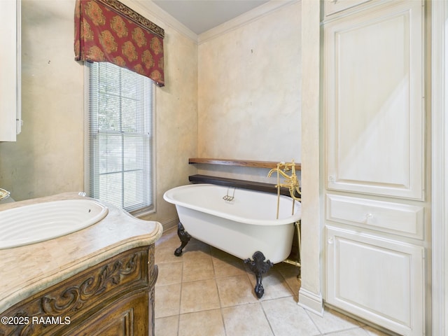 107 Wembley Rd, Lafayette, LA 70503 - bathroom with vanity, tile patterned floors, a freestanding bath, and ornamental molding