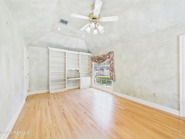 107 Wembley Rd, Lafayette, LA 70503 - unfurnished room featuring visible vents, lofted ceiling, wood finished floors, baseboards, and ceiling fan
