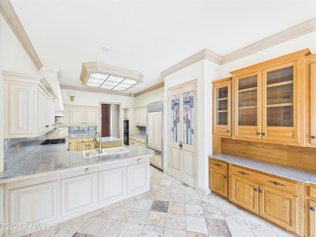 107 Wembley Rd, Lafayette, LA 70503 - kitchen with ornamental molding, stainless steel gas cooktop, a peninsula, glass insert cabinets, and a sink