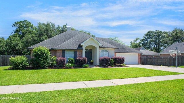502 River Woods Dr, Lafayette, LA 70508 - view of front of property with concrete driveway, an attached garage, brick siding, and roof with shingles