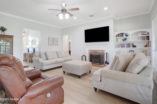 502 River Woods Dr, Lafayette, LA 70508 - living area featuring ceiling fan, light wood finished floors, a brick fireplace, ornamental molding, and recessed lighting