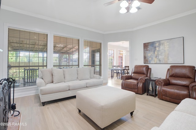 502 River Woods Dr, Lafayette, LA 70508 - living room with ceiling fan, ornamental molding, and light wood-style floors