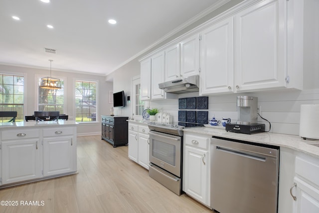 502 River Woods Dr, Lafayette, LA 70508 - kitchen featuring appliances with stainless steel finishes, under cabinet range hood, ornamental molding, white cabinetry, and light wood-style flooring