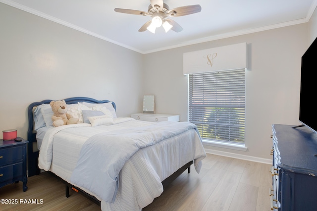 502 River Woods Dr, Lafayette, LA 70508 - bedroom with light wood finished floors, ornamental molding, baseboards, and a ceiling fan